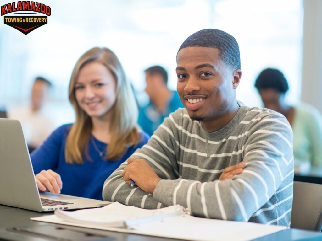 Student Towing and Roadside Guide for Western Michigan University and Kalamazoo College Drivers 2 College student receiving roadside assistance near Kalamazoo College in Kalamazoo MI